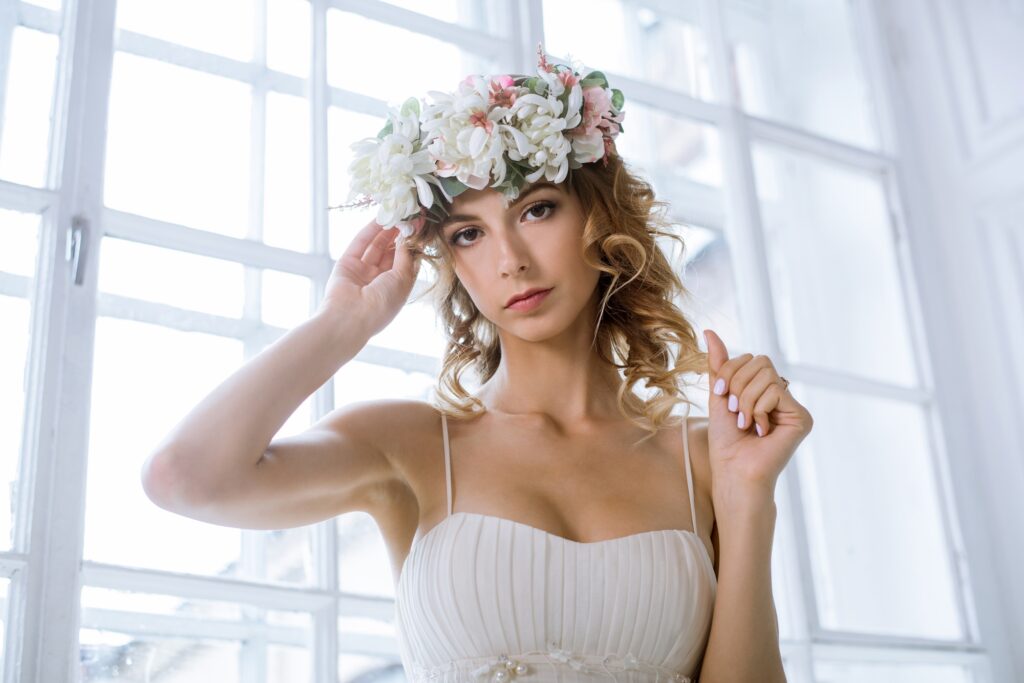 Brunette bride in fashion white wedding dress with makeup