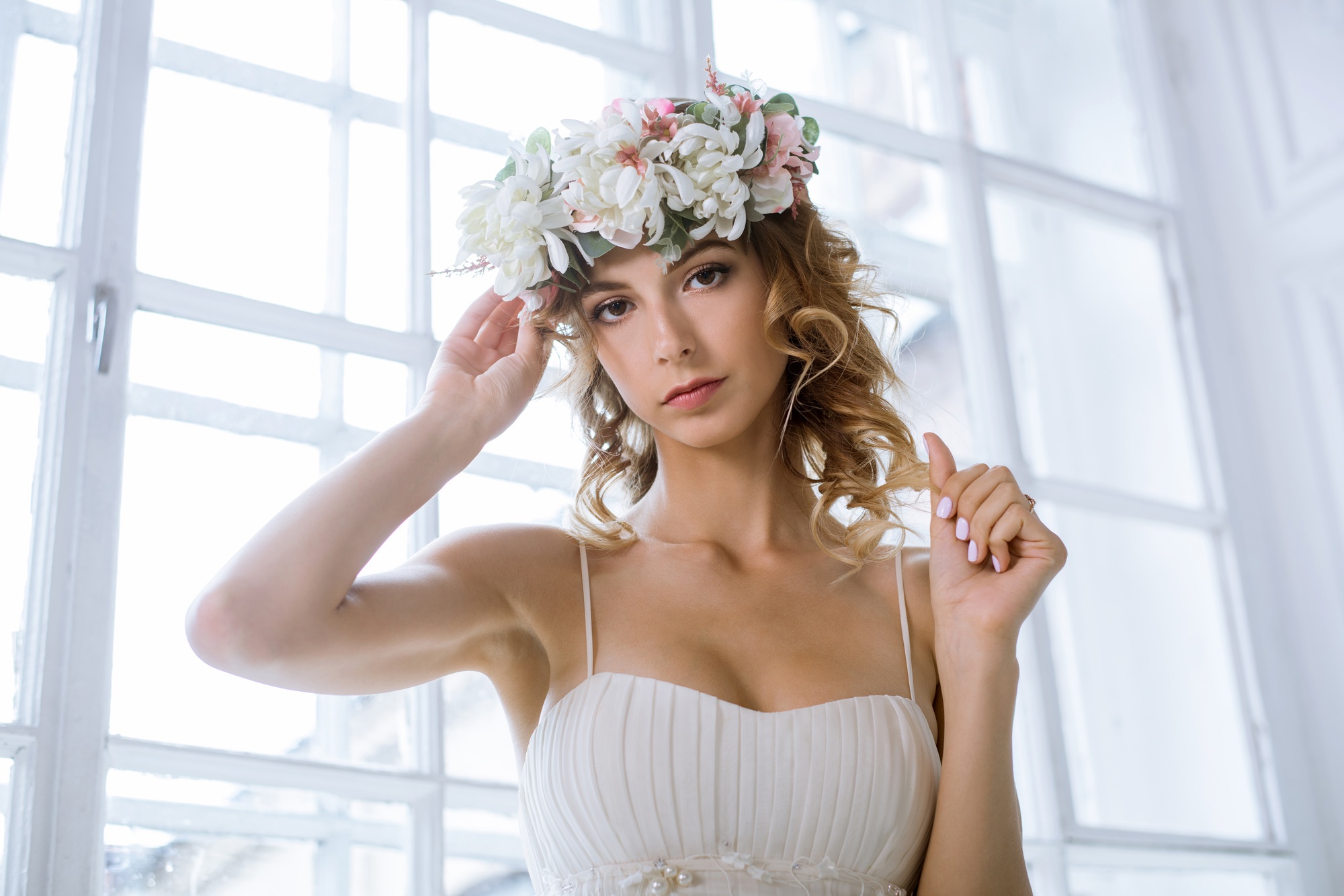 Brunette bride in fashion white wedding dress with makeup
